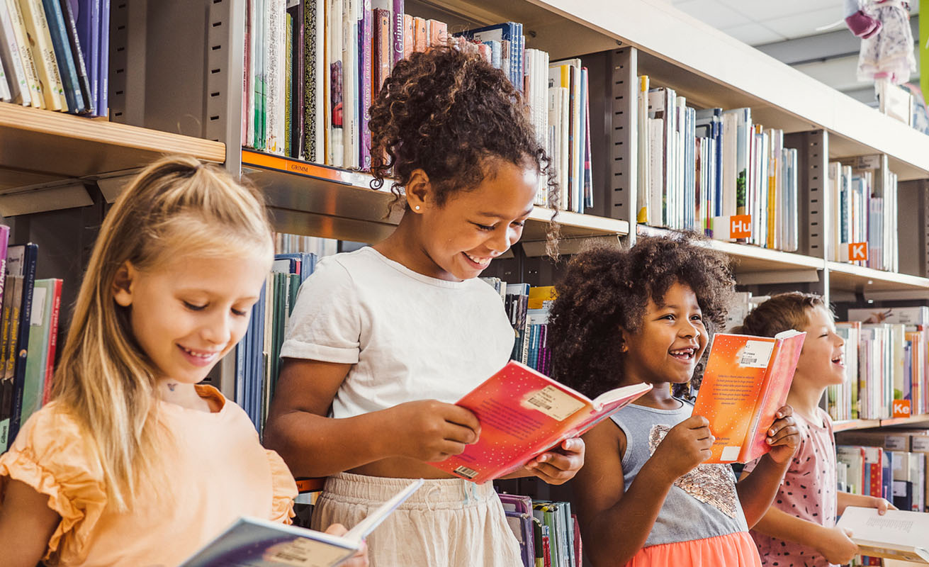 group of elementary students reading as a group